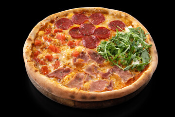 Hot Pizza 4 Seasons with Pepperoni salami, feta cheese, mozzarella cheese, ham, tomatoes, arugula and pizza sauce isolated on black background. High quality photo