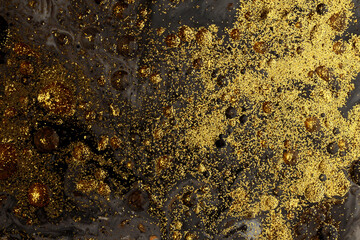Art flow pour oil and glitter color painting blot drop wall. Abstract black and gold  texture...