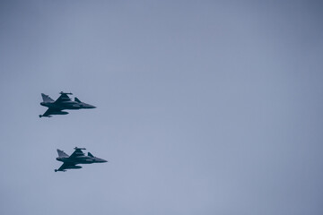 Fototapeta na wymiar Russian Multirole Jet Fighter.two fighter jets in the sky. combat formation of attack jet fighters.
