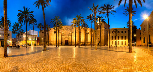 Panoramic photo of the cathedral square of Almeria in the blue hour. - obrazy, fototapety, plakaty