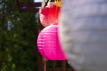 Solar pink colored solar lanterns in the home terrace