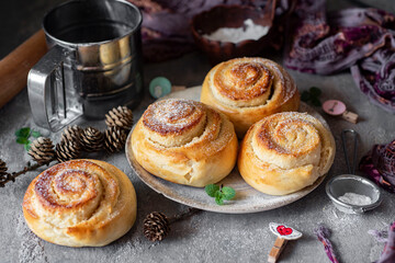 Dessert for children and adults: fluffy vanilla buns with nut filling for breakfast on a gray background. Close-up.