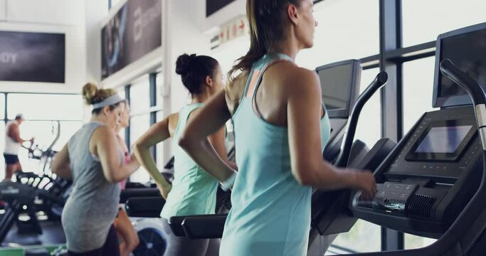 Fitness, running and treadmill with women at gym for exercise, workout and real goals. Cardio, stamina and health with people training in sports center for challenge, energy and performance