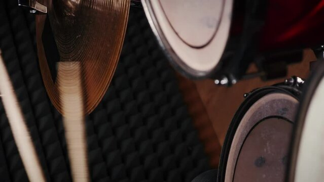 Drummer playing drum kit at music sound studio. Vertical video. Music rehearsal