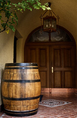 entrance with old wooden barrel
