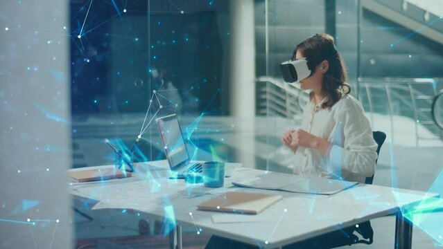 Beautiful Business Woman Wearing Virtual Reality Headset. Woman Working Using VR Goggles at Office. Growth of the VR Industry. Applications for Business. Virtual Office Environment