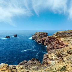 Fototapeta na wymiar Summer Atlantic rocky coast (Algarve, Portugal).