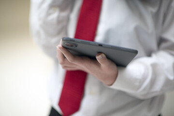 businesswoman talking by phone in office, working with tablet