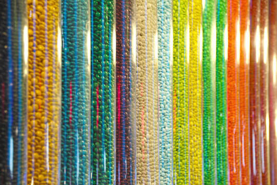 Close-up of glass containers containing candies of many colors