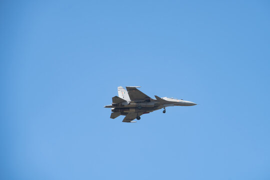 Russian fighter jet in sky maneuver.