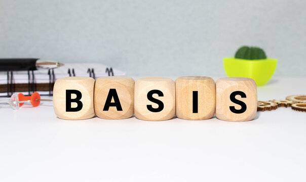 White tile alphabet letter with word basis on wood background.
