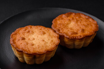 Delicious baked cupcake or tartlet with cheese and raisins