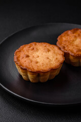 Delicious baked cupcake or tartlet with cheese and raisins