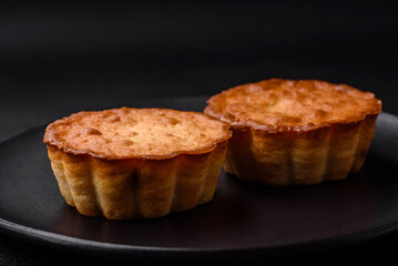 Delicious baked cupcake or tartlet with cheese and raisins