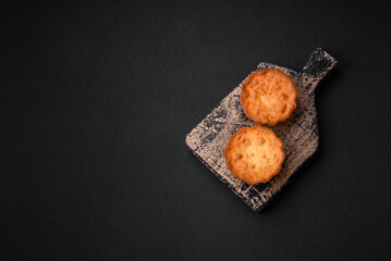 Delicious baked cupcake or tartlet with cheese and raisins