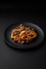Delicious stew with potatoes, tomatoes, beef, onions and carrots