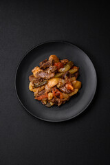 Delicious stew with potatoes, tomatoes, beef, onions and carrots