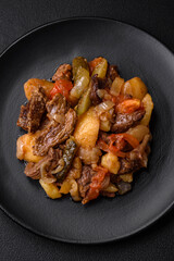 Delicious stew with potatoes, tomatoes, beef, onions and carrots