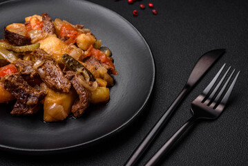 Delicious stew with potatoes, tomatoes, beef, onions and carrots