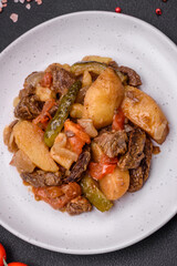 Delicious stew with potatoes, tomatoes, beef, onions and carrots