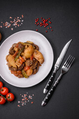 Delicious stew with potatoes, tomatoes, beef, onions and carrots