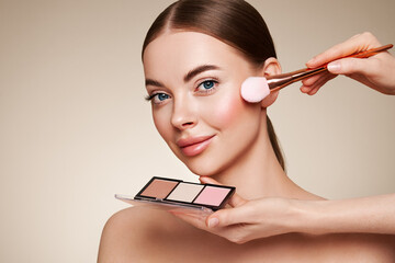 Makeup Artist applies Eye Shadow. Beautiful Woman Face. Perfect Makeup. Make-up detail. Beauty Girl...