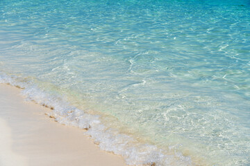 Tropical beach with white sand and blue water in Paradise Island, Bahamas