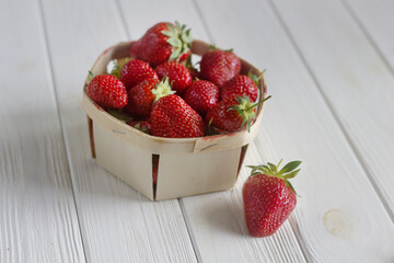 Strawberries on white wooden background