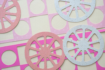 machine-cut shapes featuring circle and square patterns or cutouts and wagon wheels
