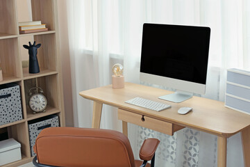 Modern teenager's room interior with stylish workplace