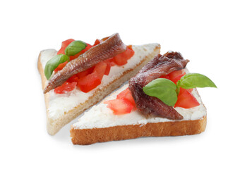 Delicious sandwiches with cream cheese, anchovies, tomatoes and basil on white background