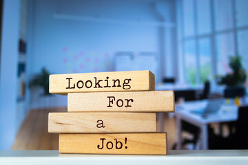 Wooden blocks with words 'Looking For a Job'.
