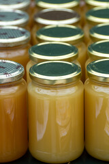 Organic honey from farm bee apiary on mountains meadows with summer wild flowers for sale in farm shop