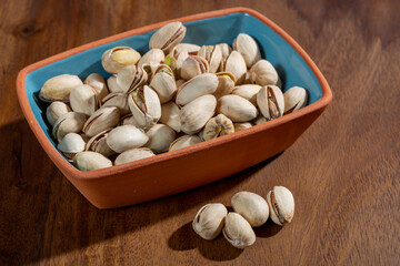 Roasted salty pistachio nuts, tasty healthy vegetarian food
