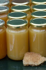 Organic honey from farm bee apiary on mountains meadows with summer wild flowers for sale in farm shop