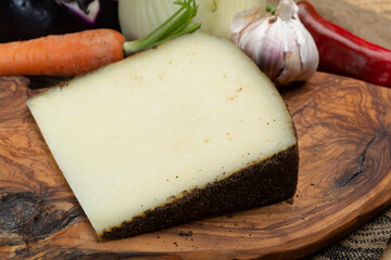 Cheese collection, aged hard Italian sheep cheese black pecorino from Sicily island or pecorino...