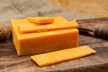 Leicestershire cheese or red leicester, British hard cheese made from cow milk close up