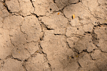 Wall texture soil dry crack pattern of drought lack of water of nature brown old broken background.
