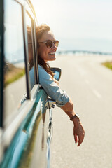 Road trip, travel and woman in window of car for adventure, summer vacation and holiday. Transport, relax and face of excited female person in motor vehicle for freedom, journey and happy outdoors