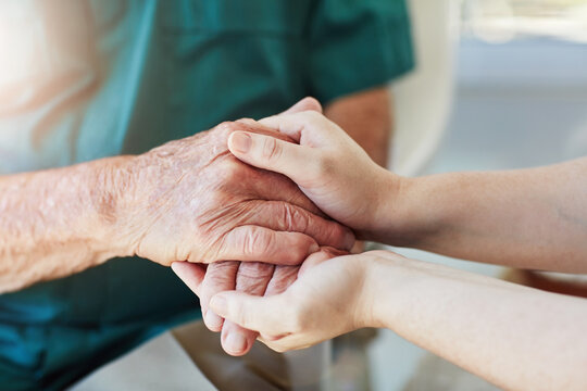 Elderly man, woman and holding hands for care, support and empathy while together for closeup. Hand of senior male and person for hope, trust and kindness or help with life insurance and health