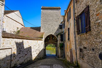Fototapeta na wymiar Postern in the medieval walled town of Moret-sur-Loing in Seine et Marne, France - It was a gate in the fortifications allowing carts with cattle to go drink at the river