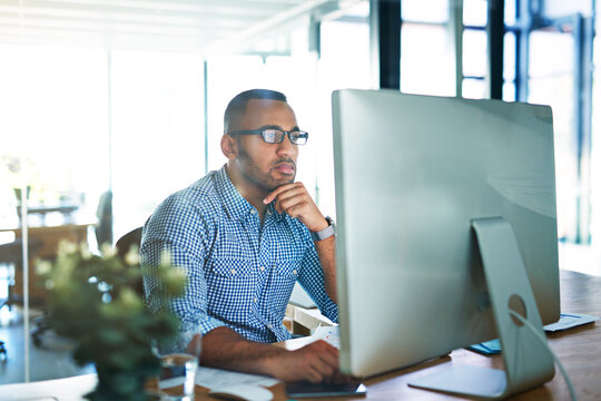 Business man, thinking and computer at desk in office for online research, reading email or report. Male entrepreneur person with internet connection for feedback, review and focus on project