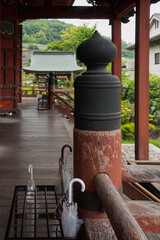 Fototapeta na wymiar Decorative pillar in historic buddhist temple in Japan. Wabi-sabi. 