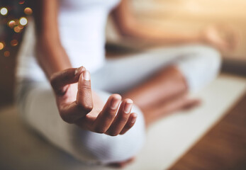 Woman, hands and yoga in meditation for relax, zen workout or spiritual wellness on floor mat at home. Closeup of female yogi hand for calm relaxation, awareness or mental wellbeing indoors