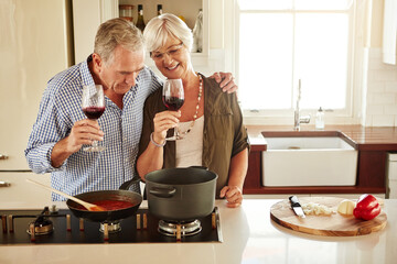 Hug, wine or happy old couple cooking food for a healthy vegan diet together with love in retirement at home. Cheers or senior woman drinking or bonding in house kitchen with mature husband at dinner