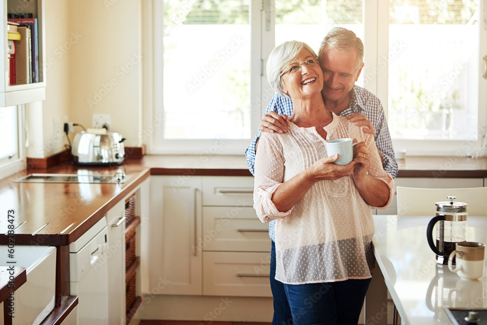 Canvas Prints Hugging, coffee or old couple laughing in kitchen at home bonding or enjoying quality time together. Embrace, retirement or happy mature man talking, relaxing or drinking tea with funny senior woman