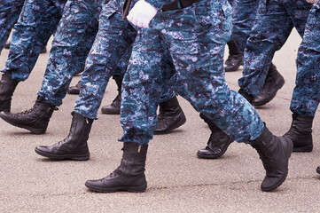 Soldiers marching in the parade on Victory Day. Construction step close up.