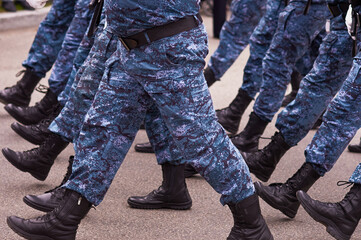 Soldiers marching in the parade on Victory Day. Construction step close up.