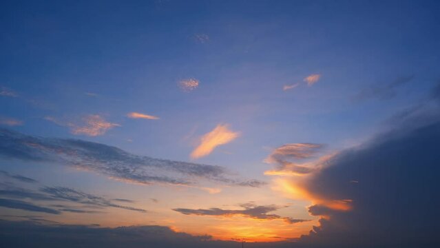 Vibrant hues cascade across the horizon as the sun descends, painting the sky in a mesmerizing tapestry of warm oranges, purples. Creating a captivating time lapse of nature. Sunset timelapse. 4K HDR
