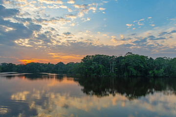 Fototapeta na wymiar Amazon rainforest river sunrise, Yasuni national park, Ecuador.